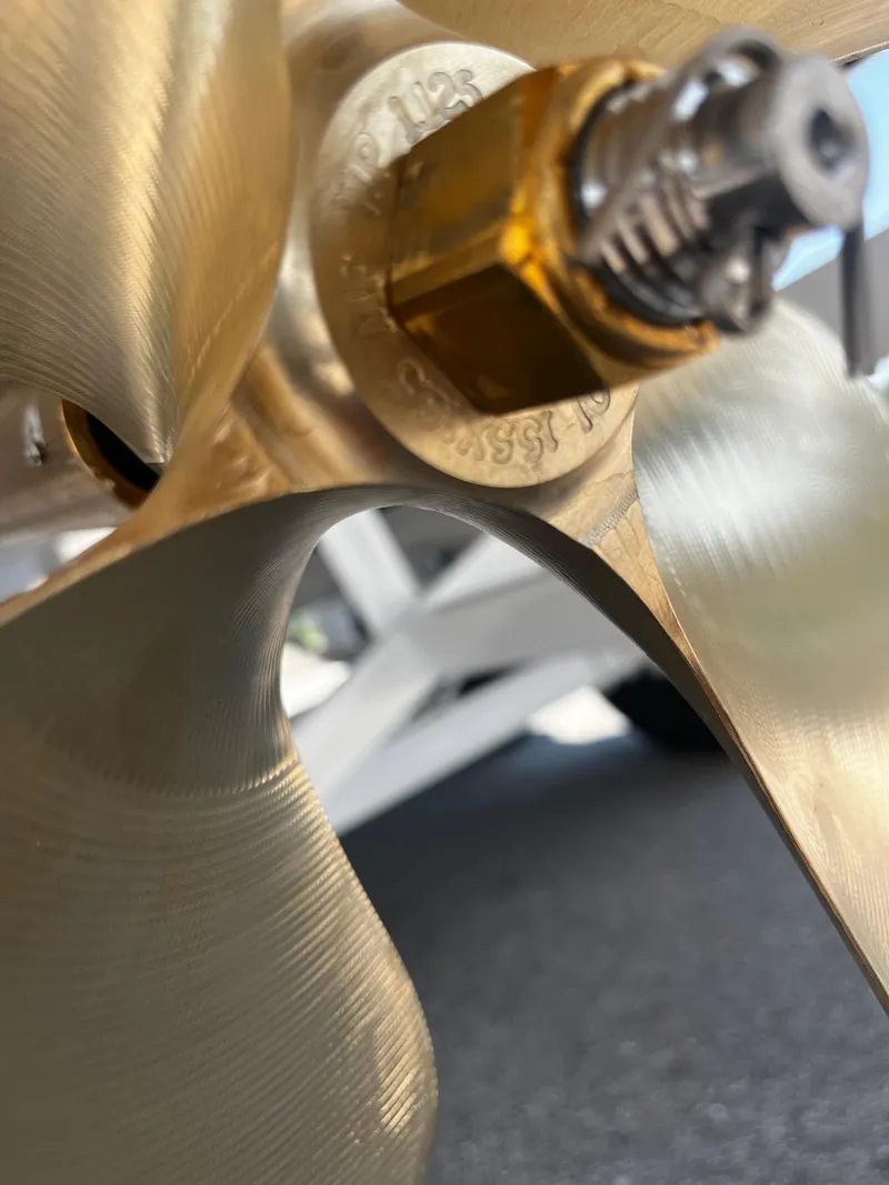 Slide: The Image of Close-up of a 2025 Moomba Max boat propeller, showcasing its metallic blades. - 8
