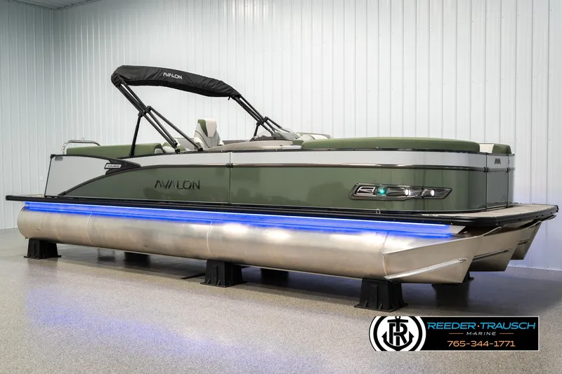 Slide: The Image of 2025 Avalon Catalina Entertainer pontoon boat with sleek design and blue underglow lighting. - 1