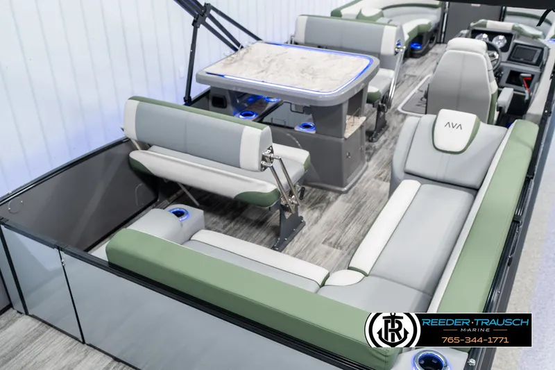Slide: The Image of 2025 Avalon Catalina Entertainer boat interior with modern seating and table setup. - 11