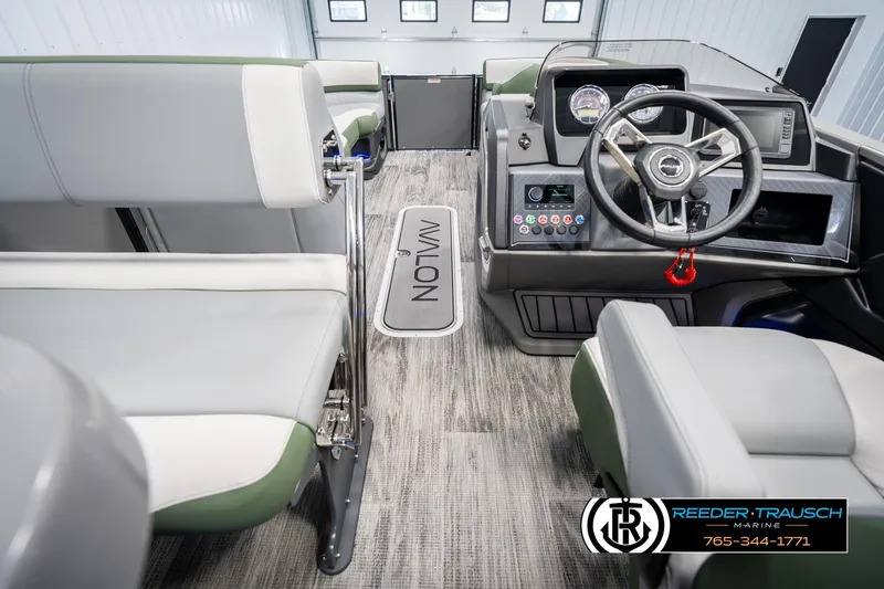 Slide: The Image of 2025 Avalon Catalina Entertainer boat interior with modern dashboard and seating. - 16