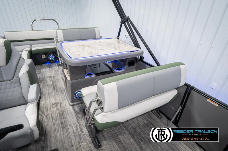 Slide: The Image of 2025 Avalon Catalina Entertainer interior with modern seating and illuminated table. - 19