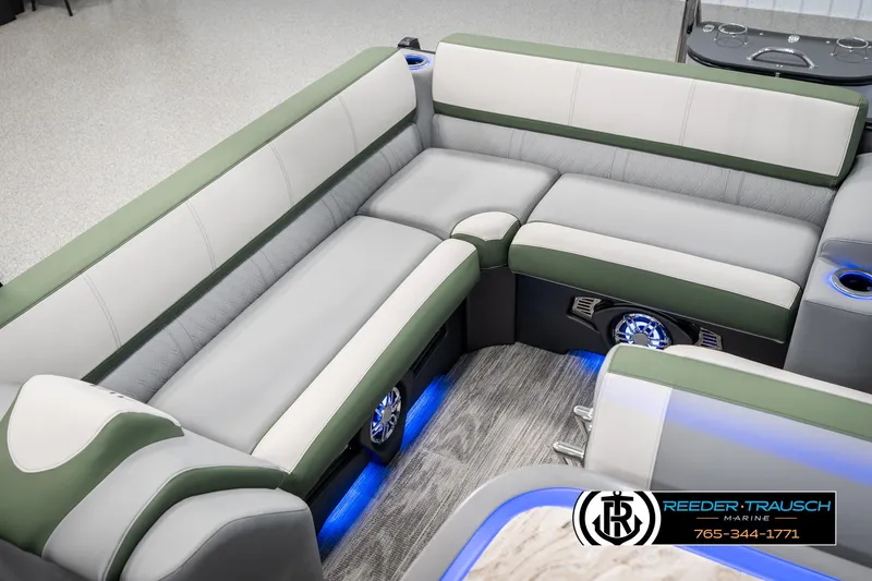 Slide: The Image of Luxurious seating in 2025 Avalon Catalina Entertainer boat with ambient blue lighting. - 22