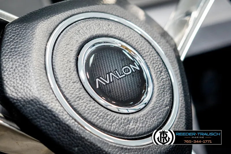 Slide: The Image of Close-up of 2025 Avalon Catalina Entertainer steering wheel with logo detail. - 30