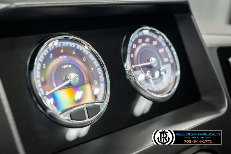 Slide: The Image of Close-up of 2025 Avalon Catalina Entertainer dashboard gauges, featuring RPM and speedometer. - 32
