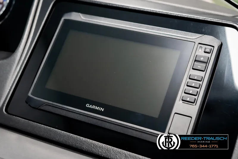 Slide: The Image of Garmin display on 2025 Avalon Catalina Entertainer boat dashboard, featuring control buttons. - 33
