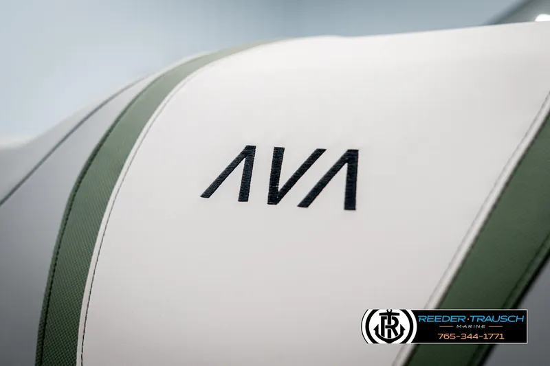 Slide: The Image of 2025 Avalon Catalina Entertainer seat with logo, featuring green and white upholstery. - 35