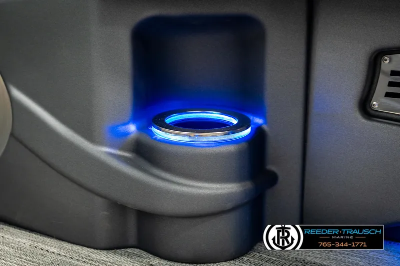 Slide: The Image of LED-lit cup holder on 2025 Avalon Catalina Entertainer boat interior. - 39