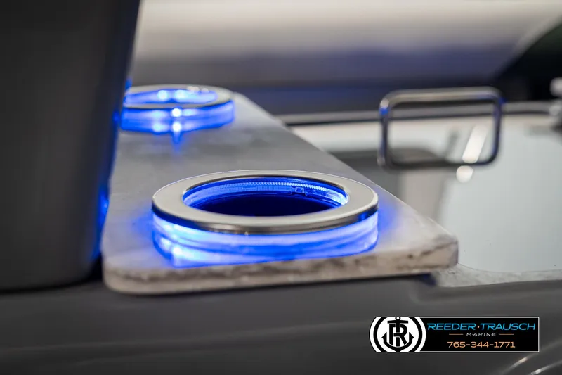 Slide: The Image of LED cup holders on 2025 Avalon Catalina Entertainer boat, featuring blue illumination. - 41