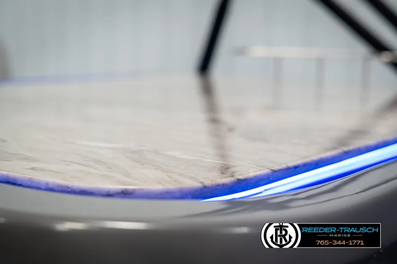 Slide: The Image of 2025 Avalon Catalina Entertainer boat with sleek design and blue LED lighting. - 42