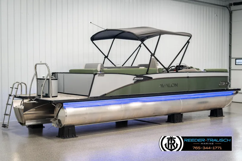 Slide: The Image of 2025 Avalon Catalina Entertainer pontoon boat with canopy in a showroom. - 5