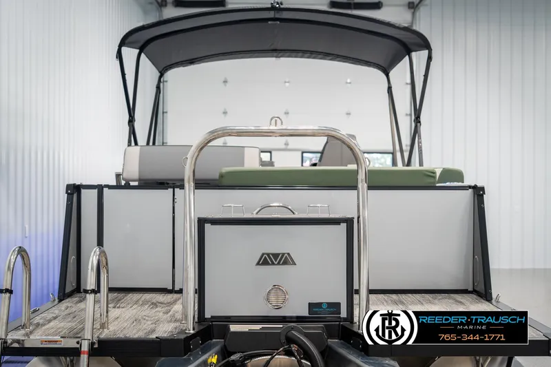 Slide: The Image of 2025 Avalon Catalina Entertainer boat in showroom, rear view with canopy and seating. - 6