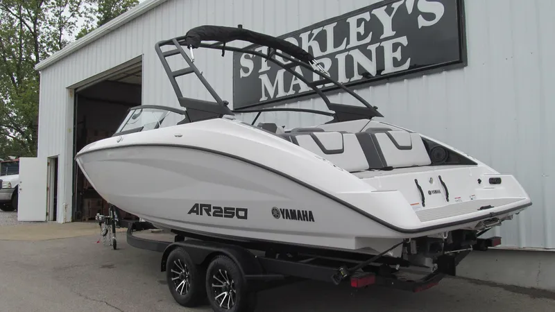 Slide: The Image of 2025 Yamaha AR250 boat on trailer at Stokley's Marine dealership. - 2