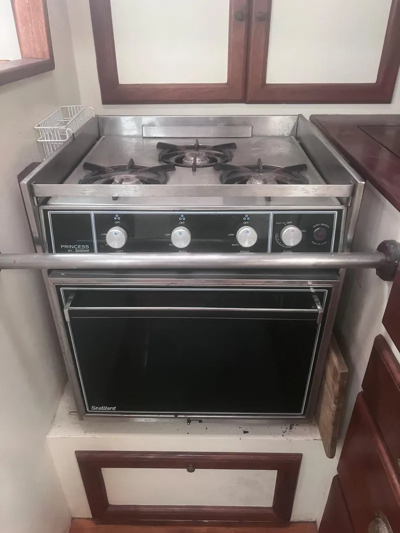 Slide: The Image of 1986 Covey Island 38 boat kitchen with a stainless steel stove and oven. - 15