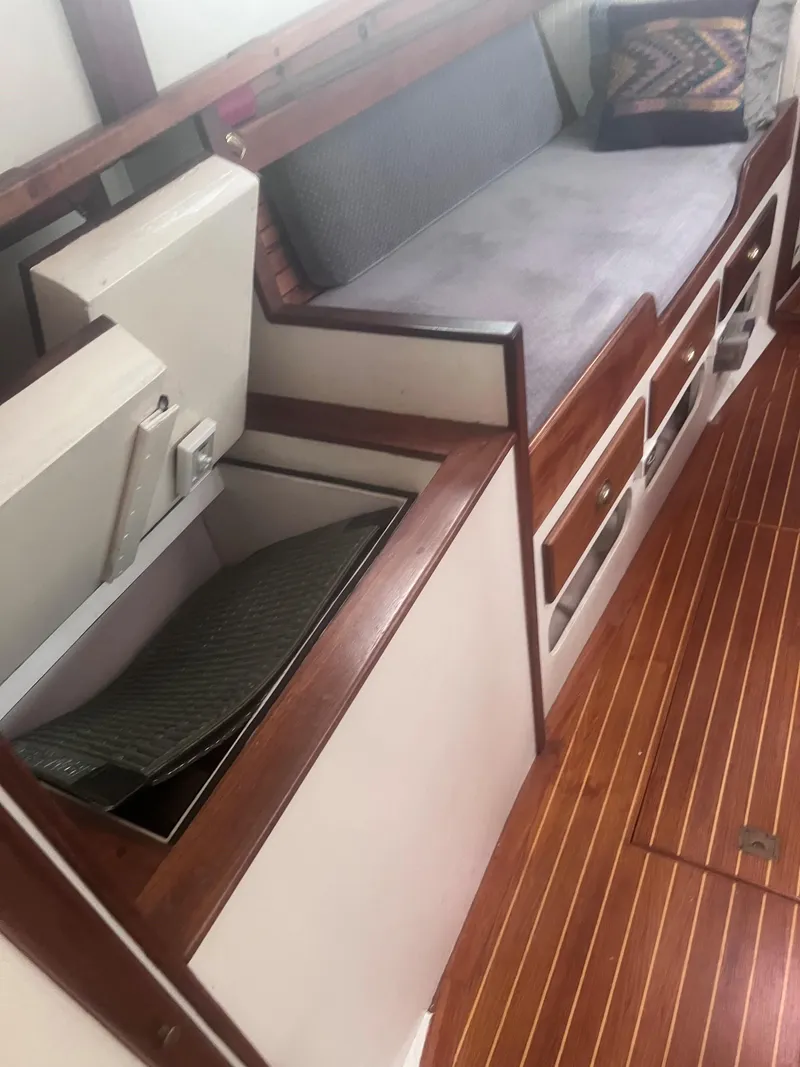 Slide: The Image of 1986 Covey Island 38 interior with wooden flooring and built-in storage. - 16