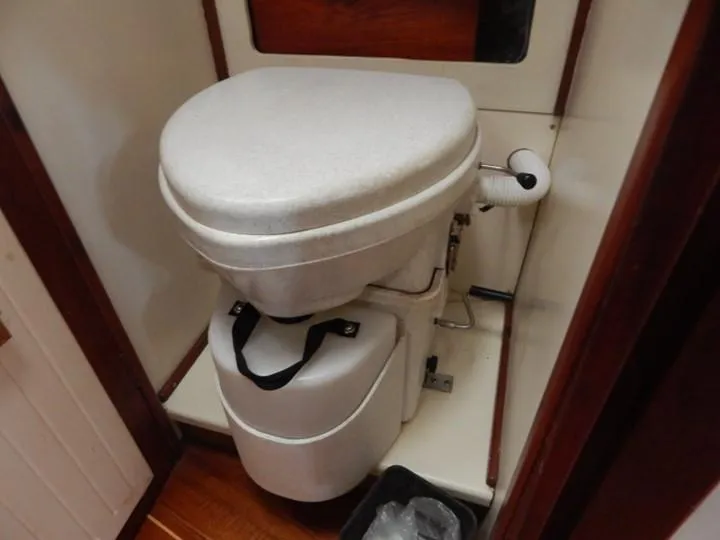 Slide: The Image of Composting toilet in a 1986 Covey Island 38 boat bathroom. - 22