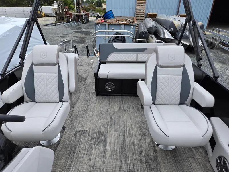Slide: The Image of 2025 Godfrey SWEETWATER 2286 SFL boat interior with plush seating and modern design. - 11