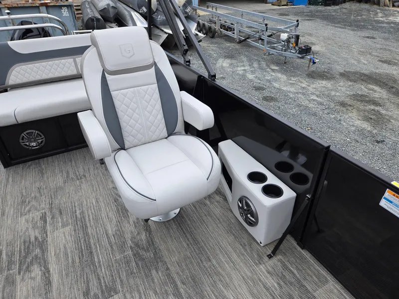 Slide: The Image of 2025 Godfrey SWEETWATER 2286 SFL boat interior with luxury seating and cup holders. - 12