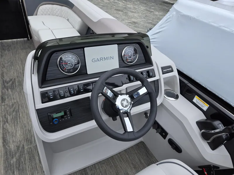 Slide: The Image of 2025 Godfrey SWEETWATER 2286 SFL boat dashboard with Garmin navigation system. - 14