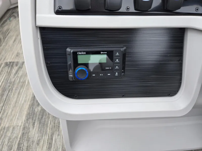 Slide: The Image of Control panel of 2025 Godfrey SWEETWATER 2286 SFL boat with Clarion audio system. - 16