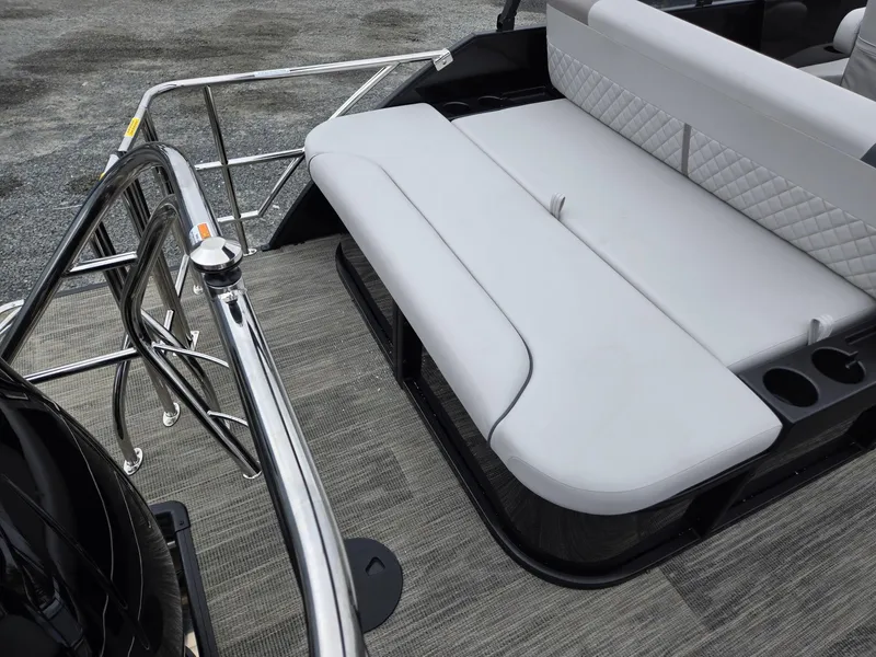 Slide: The Image of 2025 Godfrey SWEETWATER 2286 SFL boat interior with sleek seating and stainless steel railing. - 24