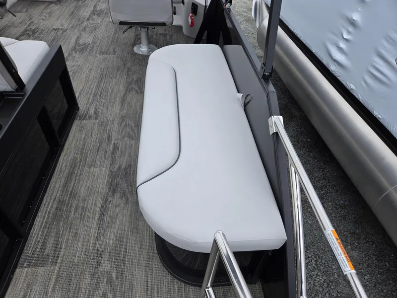 Slide: The Image of 2025 Godfrey SWEETWATER 2286 SFL boat interior with sleek seating and modern design. - 26