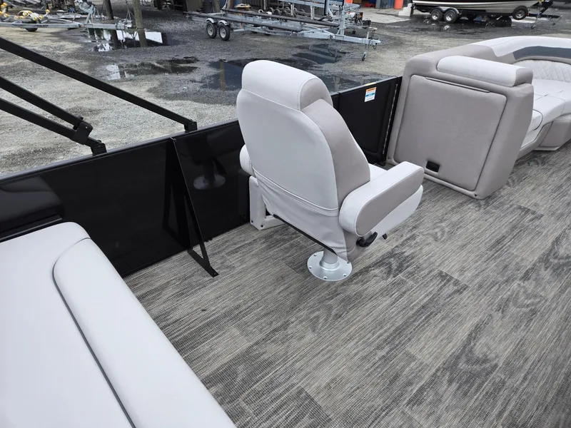 Slide: The Image of 2025 Godfrey SWEETWATER 2286 SFL boat interior with gray seating and carpeted flooring. - 28