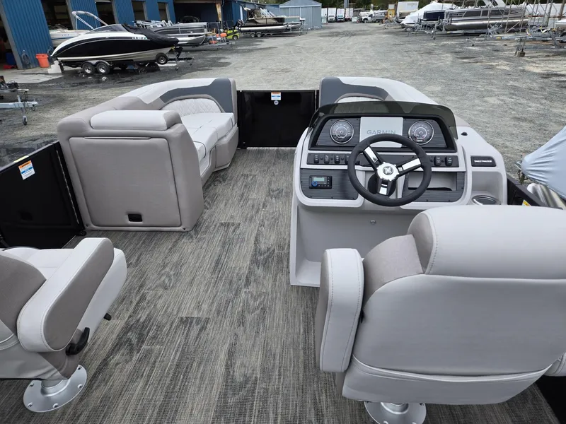 Slide: The Image of Interior of 2025 Godfrey SWEETWATER 2286 SFL pontoon boat with modern seating and controls. - 29