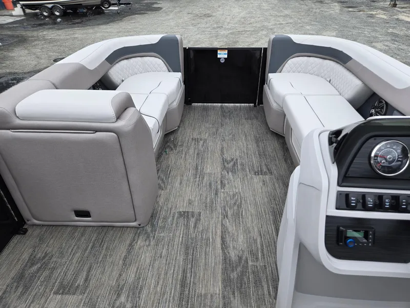 Slide: The Image of 2025 Godfrey SWEETWATER 2286 SFL pontoon boat interior with plush seating and modern dashboard. - 30