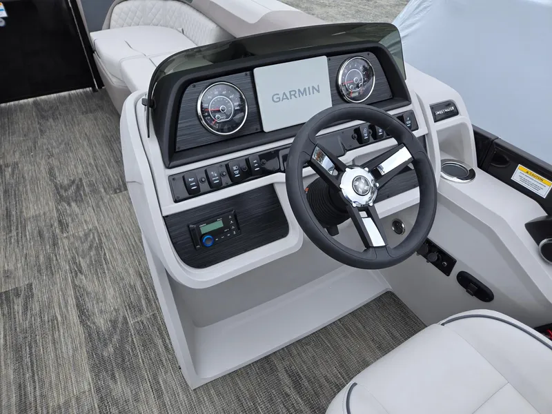 Slide: The Image of 2025 Godfrey SWEETWATER 2286 SFL boat dashboard with Garmin navigation system. - 31