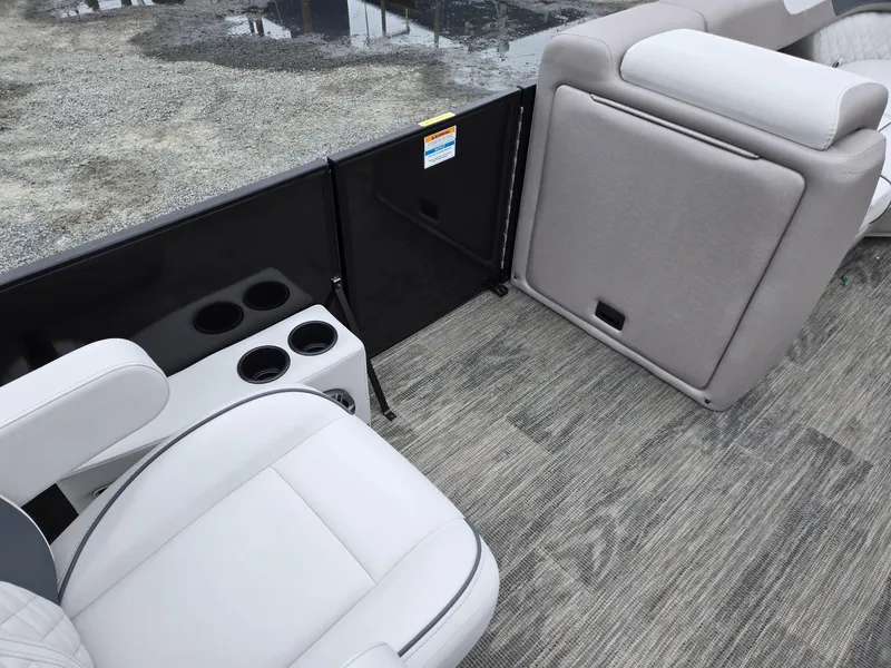 Slide: The Image of 2025 Godfrey SWEETWATER 2286 SFL boat interior with seating and cup holders. - 32