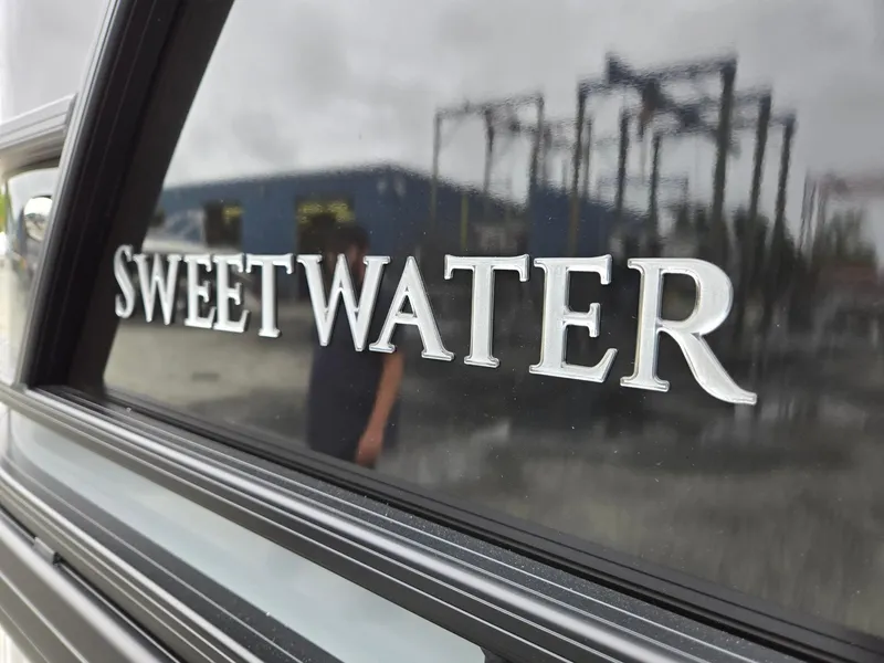 Slide: The Image of Close-up of 2025 Godfrey SWEETWATER 2286 SFL logo on reflective surface. - 37