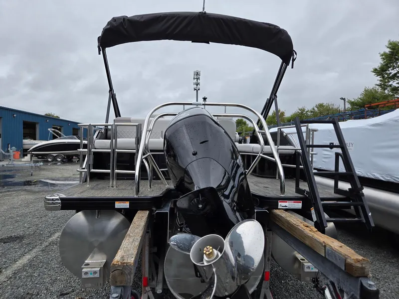 Slide: The Image of 2025 Godfrey SWEETWATER 2286 SFL pontoon boat with outboard motor, rear view. - 4