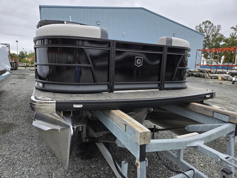 Slide: The Image of 2025 Godfrey SWEETWATER 2286 SFL pontoon boat on trailer, outdoor setting. - 7