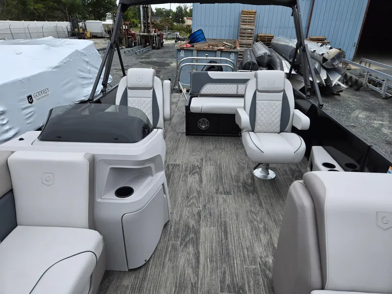 Slide: The Image of 2025 Godfrey SWEETWATER 2286 SFL pontoon boat interior with modern seating and helm. - 8