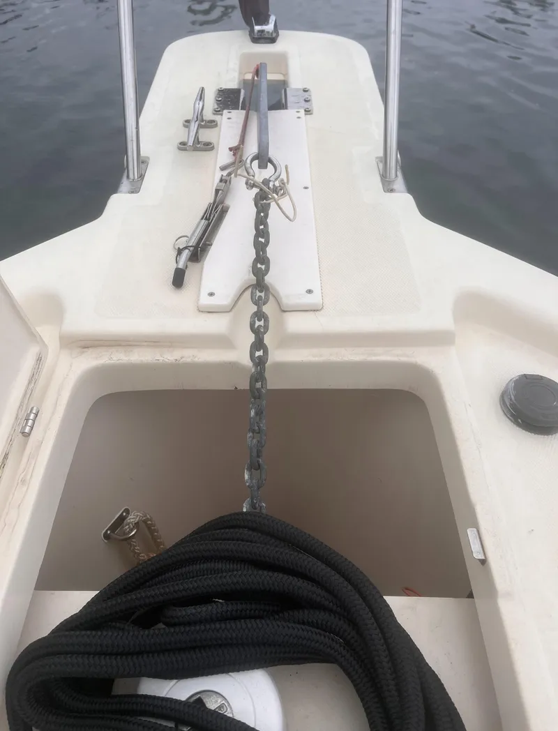 Slide: The Image of 2004 Mainship 30 Pilot II Express Cruiser anchor setup with chain and rope on deck. - 31
