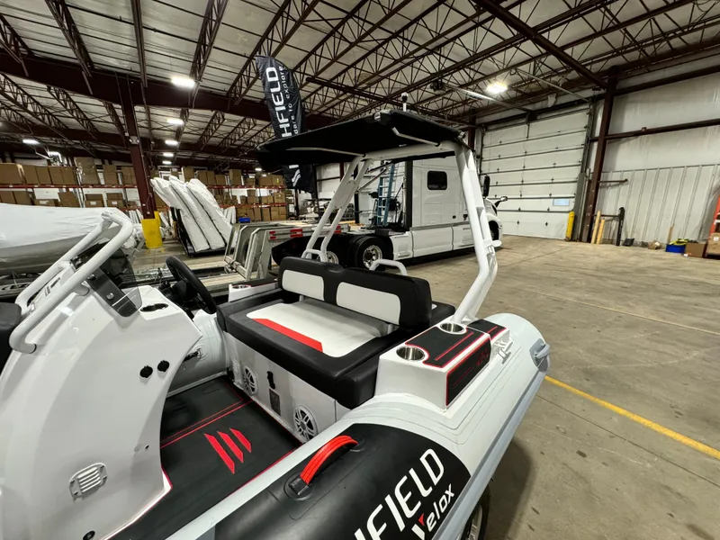 Slide: The Image of 2025 Highfield Velox 420 boat in warehouse, showcasing sleek design and modern features. - 11