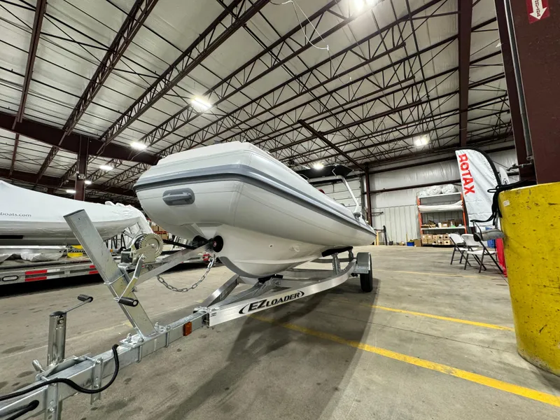 Slide: The Image of Highfield Velox 420 boat on trailer in warehouse, 2025 model. - 14