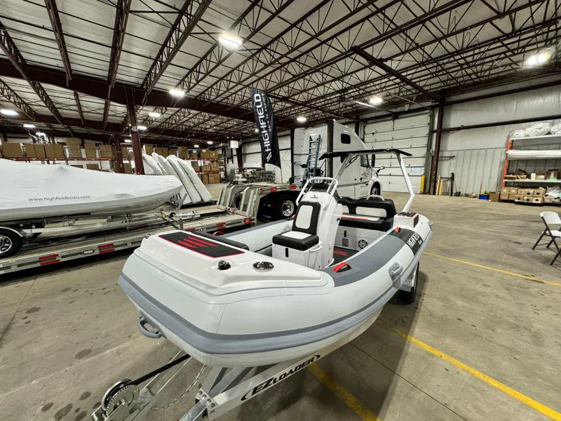 Slide: The Image of 2025 Highfield Velox 420 boat in warehouse, showcasing sleek design and modern features. - 15