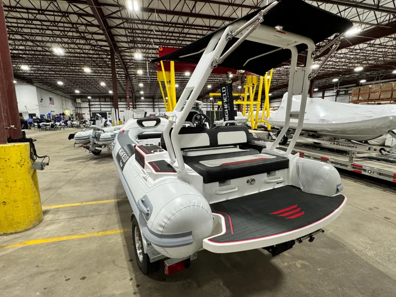 Slide: The Image of 2025 Highfield Velox 420 boat in warehouse, showcasing sleek design and modern features. - 2