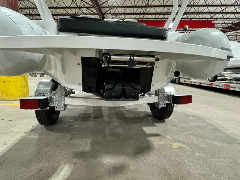 Slide: The Image of 2025 Highfield Velox 420 boat on trailer in warehouse setting. - 21