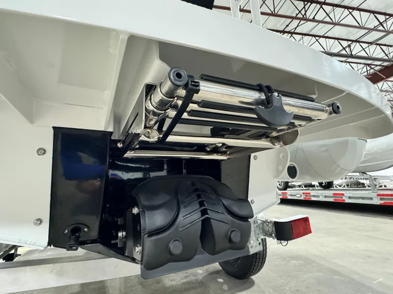 Slide: The Image of Highfield Velox 420 boat stern with ladder and motor, 2025 model, in a warehouse setting. - 23