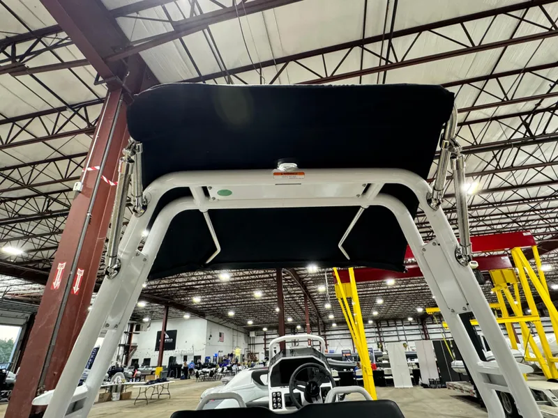 Slide: The Image of 2025 Highfield Velox 420 boat canopy in an indoor showroom. - 3