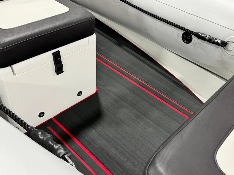 Slide: The Image of Interior of 2025 Highfield Velox 420 boat with sleek seating and red-accented flooring. - 9