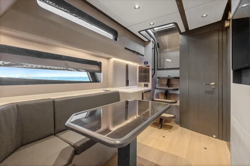 Slide: The Image of Luxurious interior of 2025 Canados 571 yacht with modern seating and sleek design. - 14
