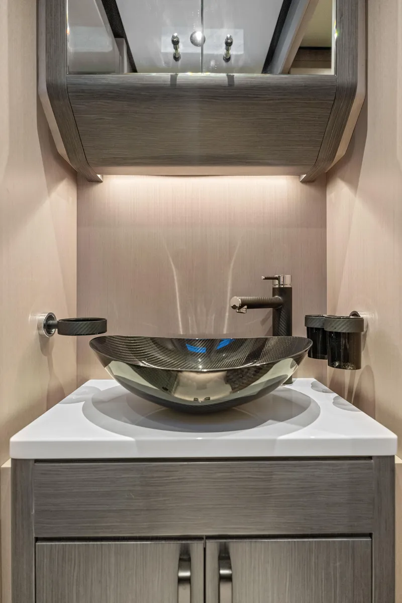 Slide: The Image of Modern bathroom sink in 2025 Canados 571 yacht, featuring sleek design and ambient lighting. - 18