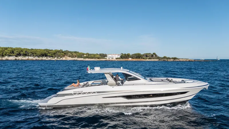 Slide: The Image of 2025 Canados 571 yacht cruising on open sea, showcasing sleek design and powerful performance. - 2