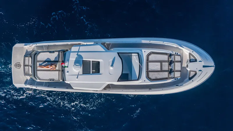 Slide: The Image of 2025 Canados 571 yacht cruising on open sea, aerial view. - 3