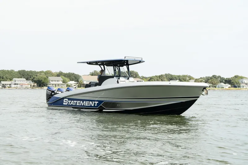 Slide: The Image of 2023 Statement 380 Open boat on trailer, featuring sleek design and powerful engines. - 0