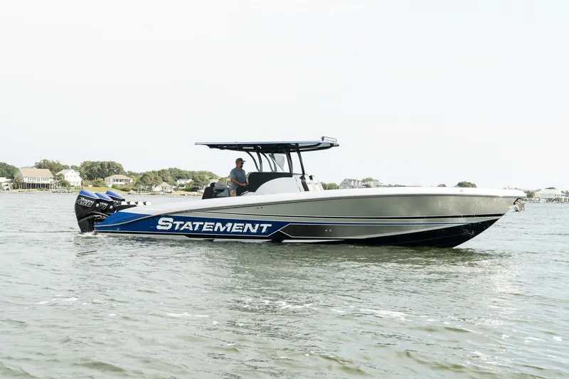 Slide: The Image of 2023 Statement 380 Open boat on water, sleek design, blue and white color scheme. - 7