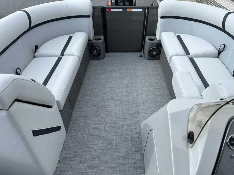 Slide: The Image of 2024 Crest Classic LX 220 SLC boat interior with gray seating and flooring. - 4